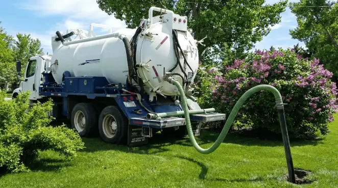Professional vacuum truck performing residential drainage and septic maintenance in Columbia, MO